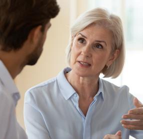 Woman speaking with audiologist