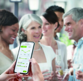 Woman using Phonak app